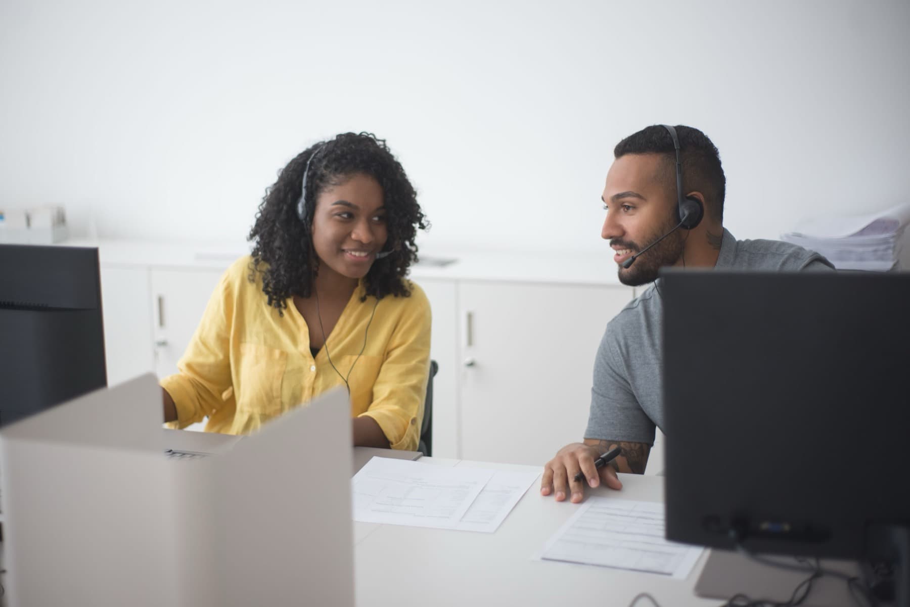 A human agent taking a warm-transferred call with full context